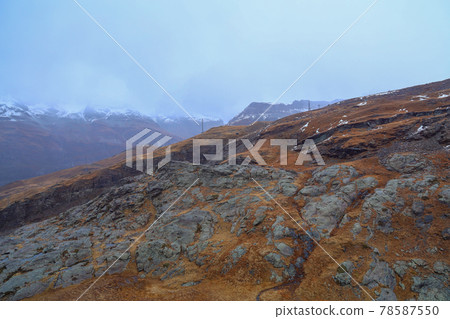View of alp mountain in autumn have snow on top hill 78587550