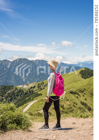 Asian climbing woman look far away 78588252