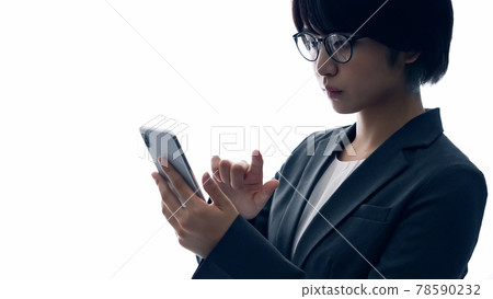 Female silhouette using a smartphone Female silhouette using a smartphone 78590232