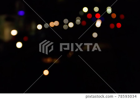 Abstract background of blurred city lights with bokeh effect 78593034