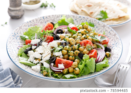 Mediterranean Greek and chickpea salad with fresh vegetables and feta cheese Mediterranean Greek and chickpea salad with fresh vegetables and feta cheese 78594485