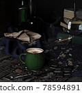 atmospheric cozy cappuccino coffee in green cup, mug side view on dark background closeup in a vintage home style. Selective focus 78594891