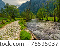 Path and river through the valley 78595037