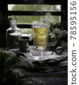 glass mug of green herbal tea front view in back light on the background of a window with kitchenware and cherry flowers closeup. Selective focus 78595156