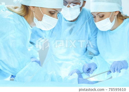 A group of surgeons is operating at the hospital. Health care concept 78595610