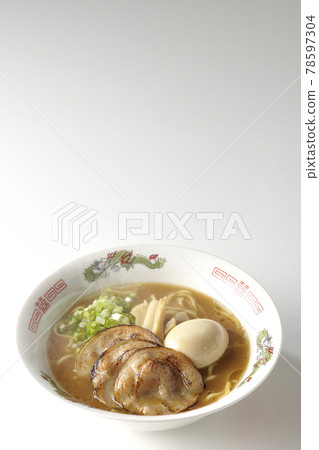 Photographed hot pork bone soy sauce ramen with roasted char siu, taste balls, menma and all-purpose green onions on a white background Photographed hot pork bone soy sauce ramen with roasted char siu, taste balls, menma and all-purpose green onions on a white background 78597304