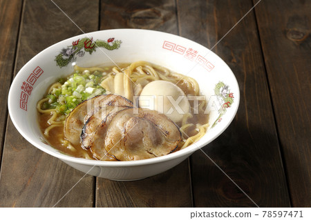 Hot pork bone soy sauce ramen with roasted char siu, taste balls, menma and all-purpose green onions 78597471