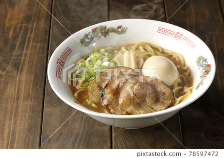 Hot pork bone soy sauce ramen with roasted char siu, taste balls, menma and all-purpose green onions 78597472