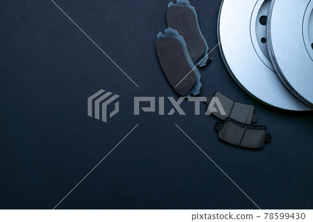 Spark plugs. Auto motor mechanic spare or automotive piece on black background. New metal car part. Flat lay, top view, copy space. 78599430