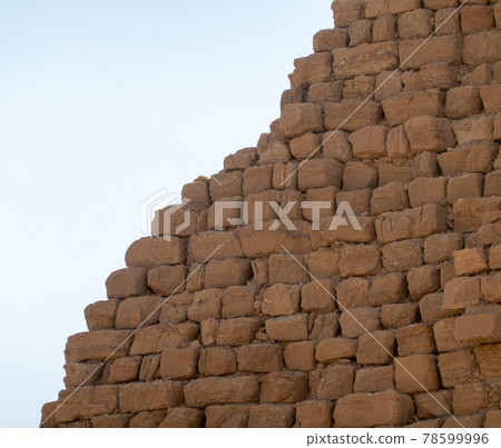 Close-up view of a pyramid made of roughly hewn sandstones and sandstone blocks in Sudan Close-up view of a pyramid made of roughly hewn sandstones and sandstone blocks in Sudan 78599996