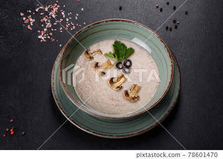 Delicious fresh hot mushroom soup in a ceramic plate. 78601470