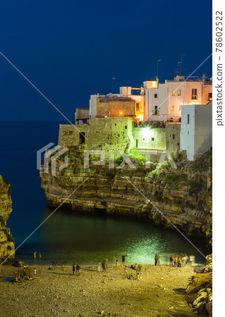 Italy, Polignano a Mare, Cala Porto coast and cliff-top townscape at night Italy, Polignano a Mare, Cala Porto coast and cliff-top townscape at night 78602522