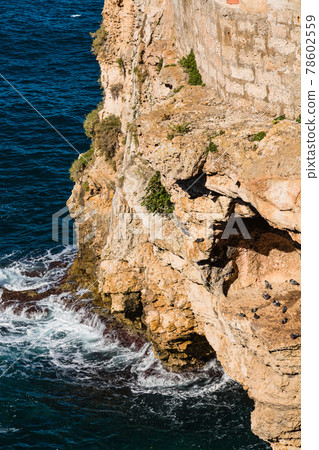 Italy, Polignano a Mare, rock face carved by waves Italy, Polignano a Mare, rock face carved by waves 78602559