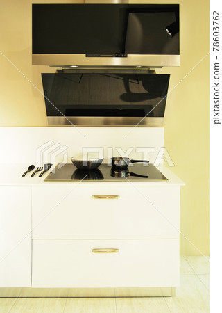 Modern kitchen and glass ceramic built-in electric oven and paddle box detail 78603762
