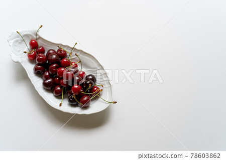 Cherry served on a white plate Cherry served on a white plate 78603862