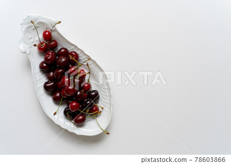 Cherry served on a white plate Cherry served on a white plate 78603866