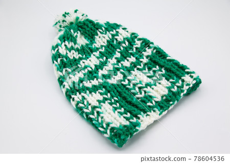 Handmade wool knitted winter green and white hat 78604536