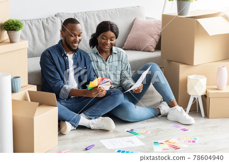 Home Renovation Concept. Black Spouses Choosing Color Palette For Decorating House 78604940