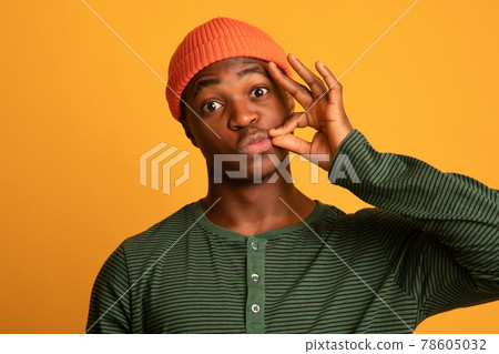 Keep Quiet. Young Black Hipster Guy Making Zipping Mouth Gesture Keep Quiet. Young Black Hipster Guy Making Zipping Mouth Gesture 78605032