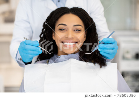 Portrait Of Happy Young Black Woman Having Check Up At Dental Clinic 78605386