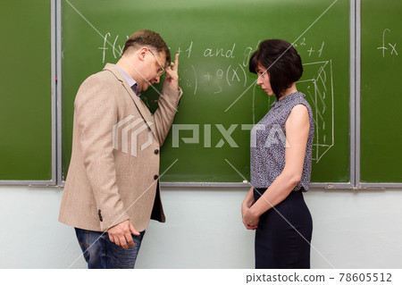 Male teacher scolds female student for wrong answer 78605512