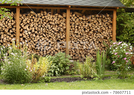 beautiful formal garden with flowers and fire wood storage beautiful formal garden with flowers and fire wood storage 78607711