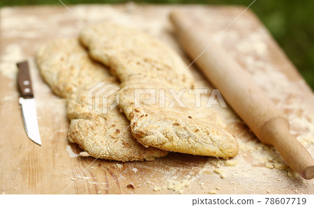 two ciabatta bread loaf fresh bake close up photo on kitchen board two ciabatta bread loaf fresh bake close up photo on kitchen board 78607719