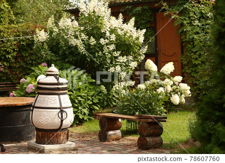 beautiful formal garden with dining place, table tandoor bench beautiful formal garden with dining place, table tandoor bench 78607760