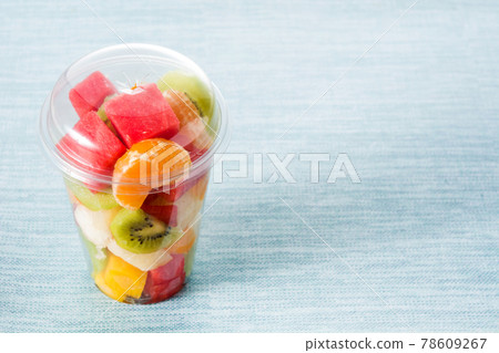 Fresh cut fruit in a plastic cup Fresh cut fruit in a plastic cup 78609267
