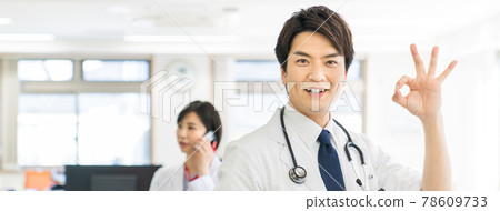 Young male doctor making an OK mark Young male doctor making an OK mark 78609733