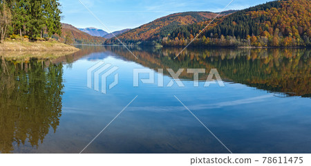 Vilshany water reservoir on the Tereblya river, Transcarpathia, Ukraine. Picturesque lake with clouds reflection. Beautiful autumn day in Carpathian Mountains. 78611475