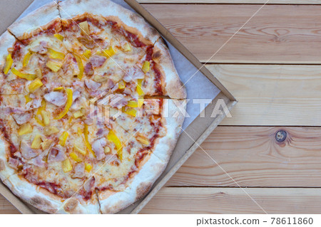 Pizza in a cardboard box on wooden background. Space for text. View from above. Pizza delivery. Pizza menu. Italian Pizza. Pizza Tonda Romana Pizza in a cardboard box on wooden background. Space for text. View from above. Pizza delivery. Pizza menu. Italian Pizza. Pizza Tonda Romana 78611860