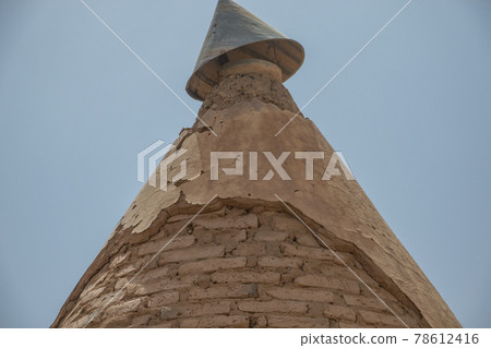 Old partially destroyed pointed roof of a railway station of the English in Sudan 78612416