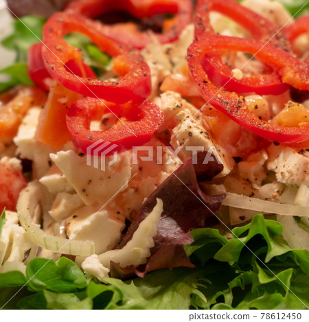 Mediterranean farmers salad with green salad leaves, red pepper and sheep cheese 78612450