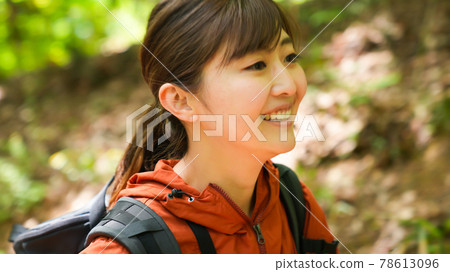 Young woman hiking in the mountains 78613096