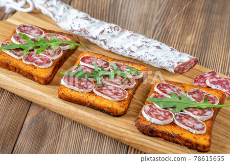 Toasts with fuet 78615655