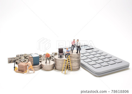 a mini business figure with the coins stacks. 78618806