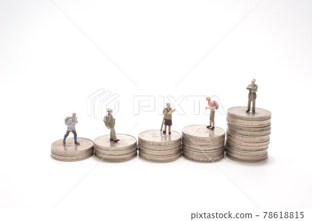 a mini figure on the pile of coins a mini figure on the pile of coins 78618815