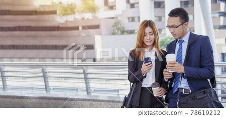 Banner Businessman Businesswoman drinking coffee in town using smartphone outside office city. Panorama Hands holding take away coffee cup, smart phone talking together Business partner copyspace Banner Businessman Businesswoman drinking coffee in town using smartphone outside office city. Panorama Hands holding take away coffee cup, smart phone talking together Business partner copyspace 78619212