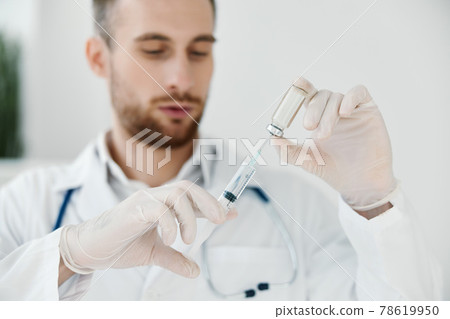 vaccination doctor in a medical gown stethoscope laboratory syringe and chemical liquid vaccination doctor in a medical gown stethoscope laboratory syringe and chemical liquid 78619950