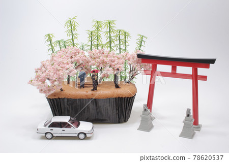 a mini figure Woman in kimono near cherry tree in full bloom a mini figure Woman in kimono near cherry tree in full bloom 78620537