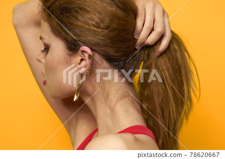 emotional woman wavy hair bright makeup lifestyle yellow background emotional woman wavy hair bright makeup lifestyle yellow background 78620667