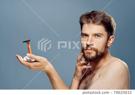 Man with razor in hand beard facial skin care morning lifestyle clean skin Man with razor in hand beard facial skin care morning lifestyle clean skin 78620832