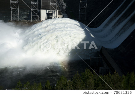 A long plume of water discharged from a hydroelectric power plant. A long plume of water discharged from a hydroelectric power plant. 78621336