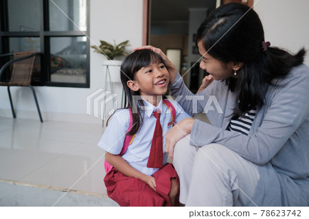 happy primary student at back home after school and talk 78623742