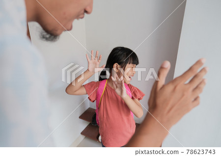 abusive parent try to hit his kid at home abusive parent try to hit his kid at home 78623743