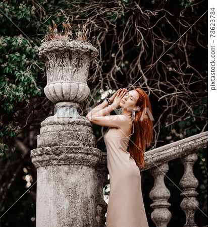 Portrait of young slim sensual woman tourist at 78623784