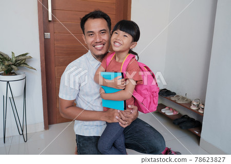asian father embrace his daughter before going to school asian father embrace his daughter before going to school 78623827