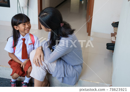 Back to school. asian pupil with primary student uniform getting ready to school Back to school. asian pupil with primary student uniform getting ready to school 78623921