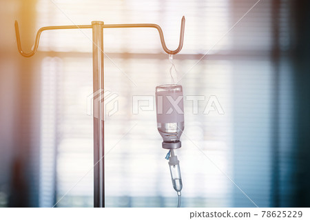 Intravenous Medication therapy or IV medicine bottle fluid drop saline drip in hospital ward, Emergency treatment injection drug infusion care chemotherapy blue light for Medical healthcare. 78625229